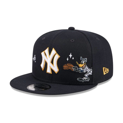 Pictured is this MLB X Looney Tunes Daffy Duck New York Yankees 9FIFTY Snapback Adjustable cap in navy. 1