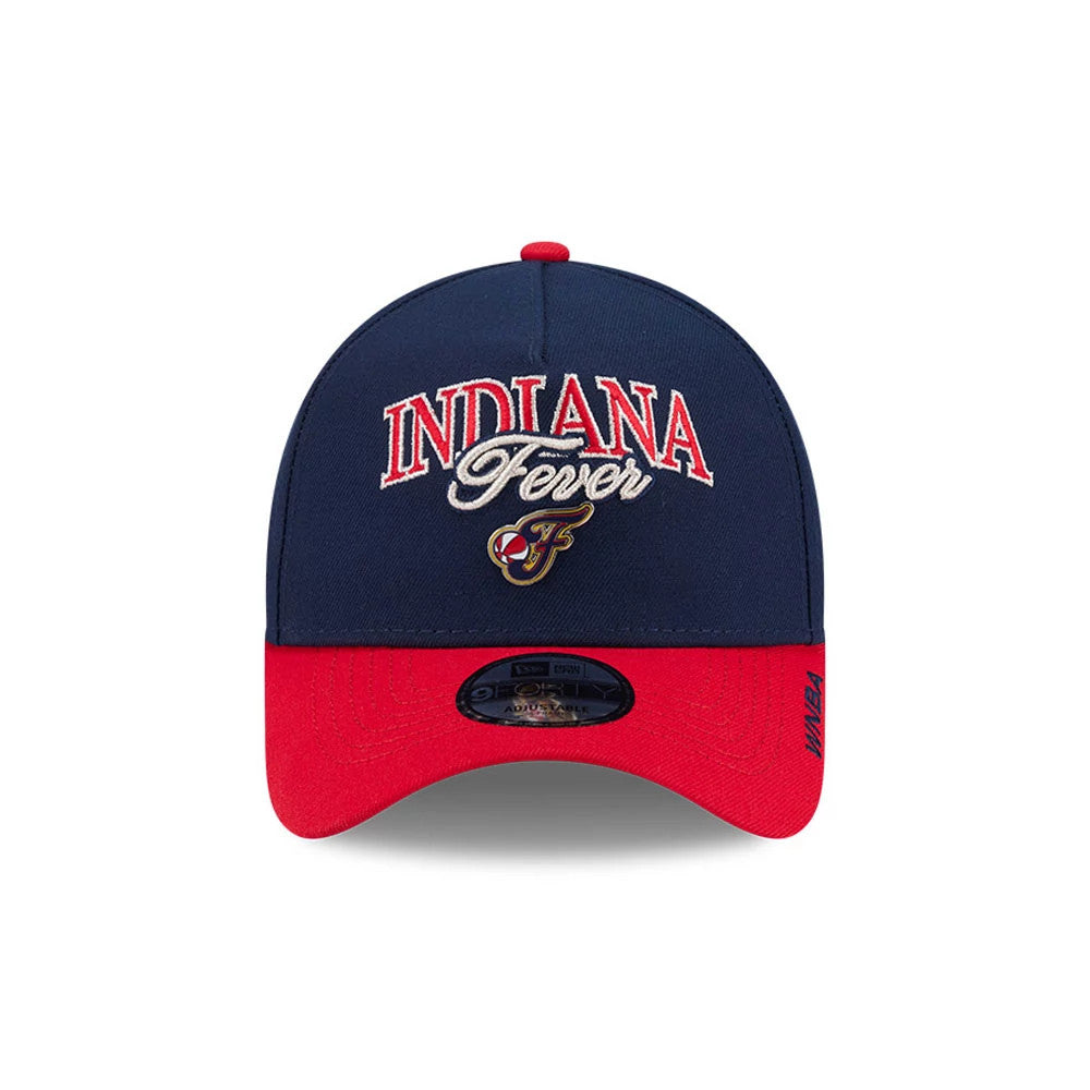 Indiana Fever WNBA Tip Off 2026 Navy New Era 9FORTY A-Frame Adjustable Cap, front view showing raised red and white embroidered Indiana Fever lettering on the structured navy crown, with a red curved visor and 9FORTY size sticker.