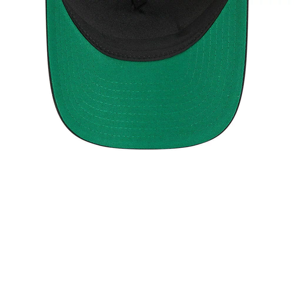 Red Wings NHL Stanley Cup Black New Era 9FORTY M-Crown A-Frame Trucker Adjustable Cap, inside view showing a contrasting green undervisor with stitching details, black sweatband lining the interior, and the cap's structured black crown.