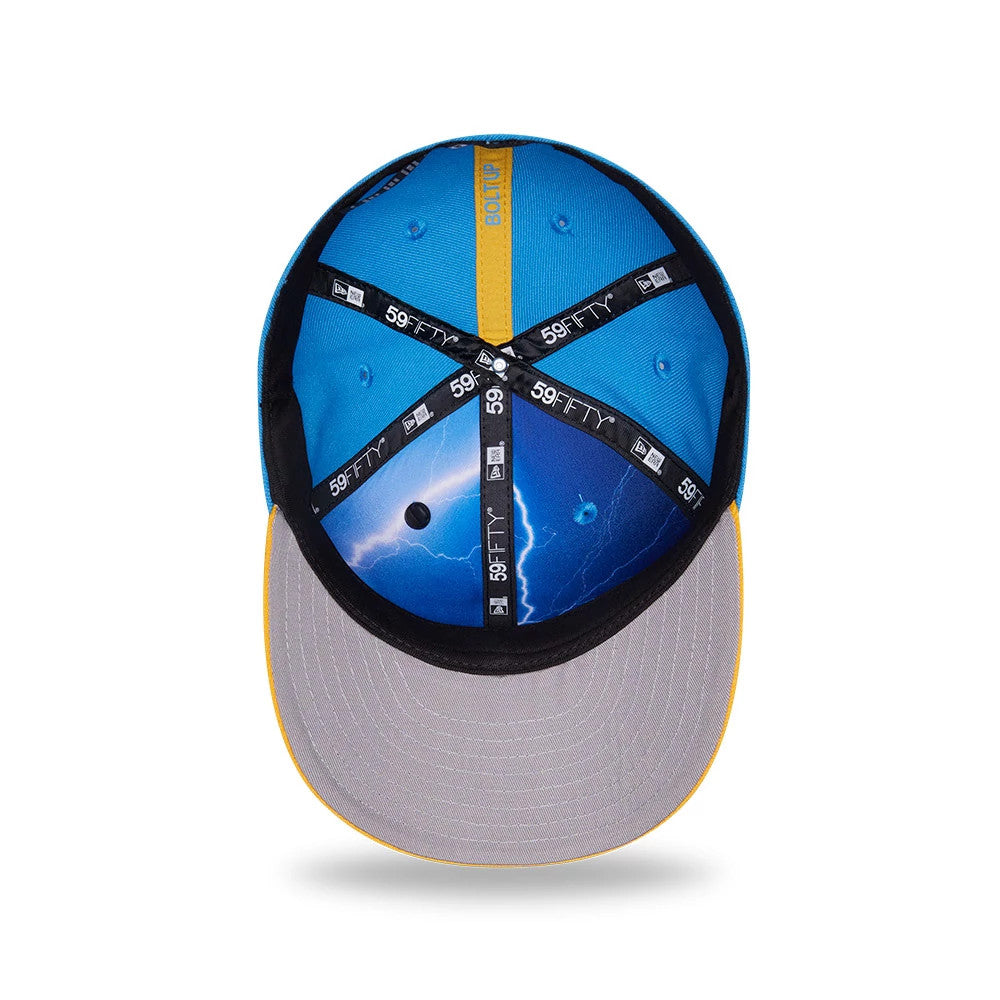 LA Chargers NFL Draft 2026 Blue New Era 59FIFTY Fitted Cap, inside view showing blue printed crown with lightning design, grey undervisor, and black taping with 59FIFTY branding, complemented by a yellow sweatband detail.