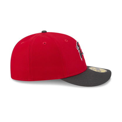 Tampa Bay Buccaneers NFL Draft 2026 Red New Era 59FIFTY Fitted Cap, side view showing the prominent Buccaneers logo on the front panel, structured red crown with matching eyelets, and contrasting grey visor with a gold 59FIFTY size sticker.
