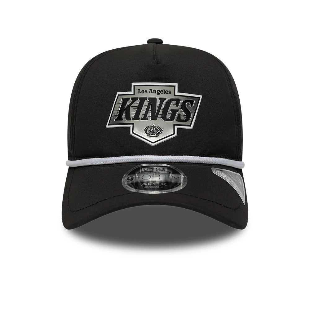 LA Kings NHL Quickstrike Black New Era 9FORTY Apex Adjustable Cap, front view showing the raised grey and black Los Angeles Kings logo embroidered on the front panel, with a curved black visor and 9FORTY size sticker placed centrally on the visor.
