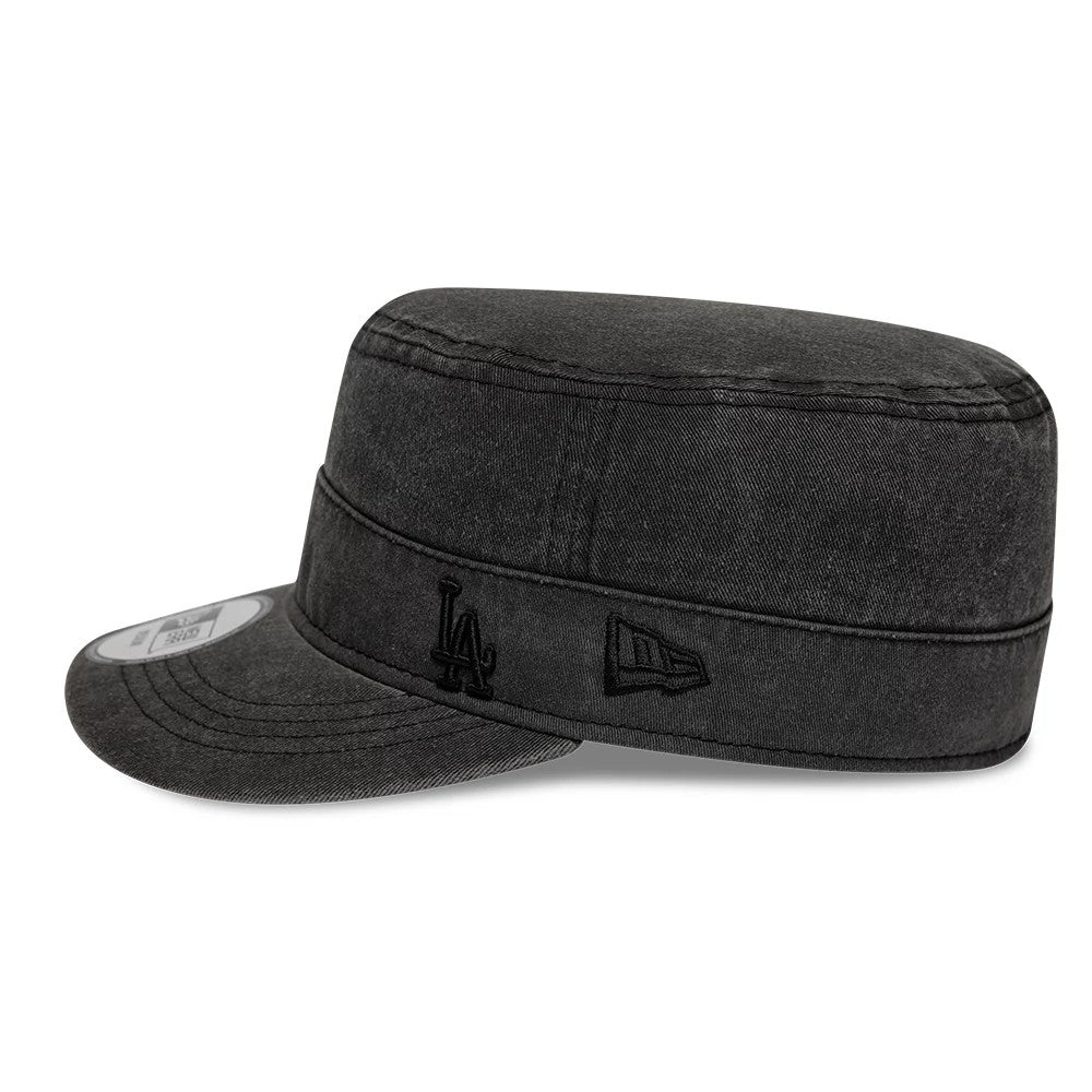 New Era LA Dodgers MLB Military Quickstrike Black Military Cap, side view showing a black embroidered LA logo and the New Era flag logo on the structured black crown, with a flat visor and a size sticker on the visor.