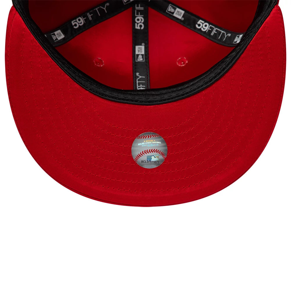 New York Yankees MLB Satin Red New Era 59FIFTY Fitted Cap, inside view showing the black taping with white logo text along the seams, contrasting against the red fabric, and featuring a size sticker on the red undervisor.