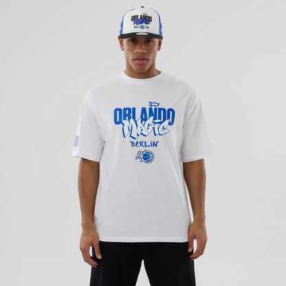 The model is wearing this NBA Berlin Game 2026 Orlando Magic Oversized T-Shirt in white. 1