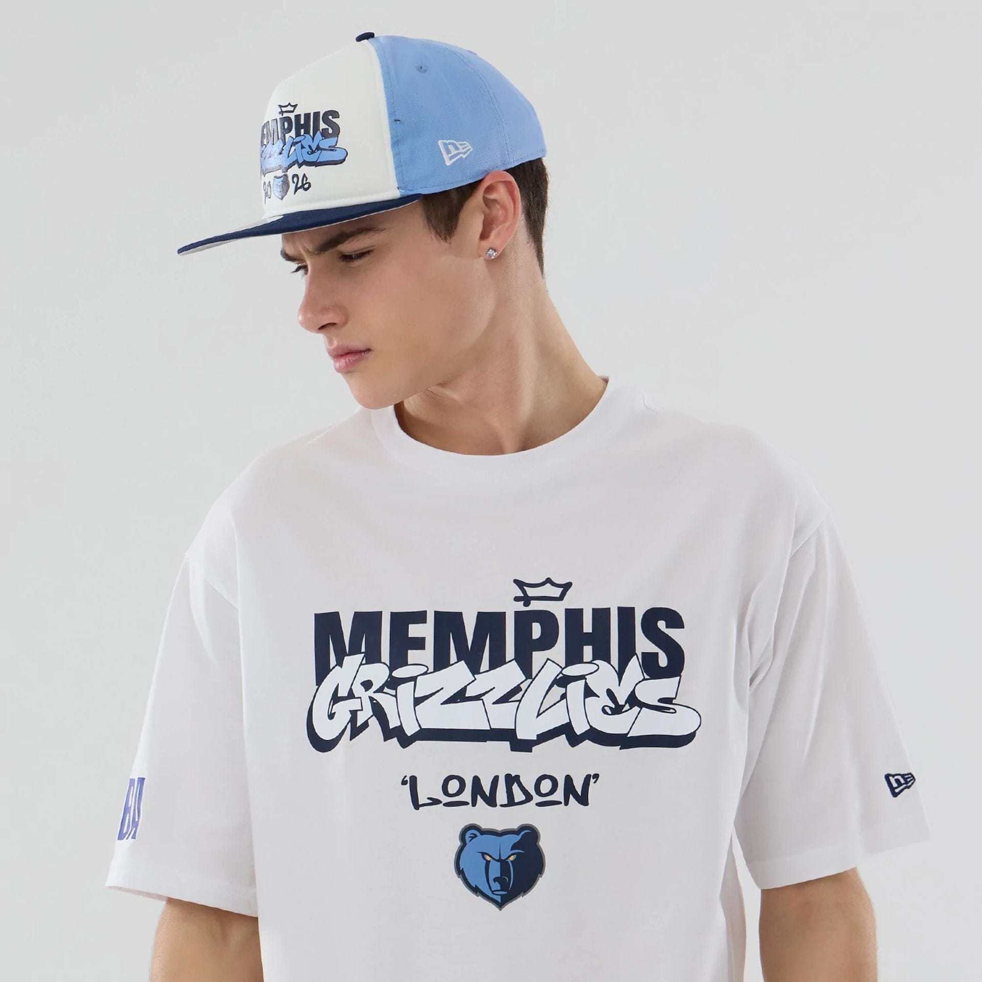 The model is wearing this NBA Berlin Game 2026 Memphis Grizzlies Oversized T-Shirt in white. 6