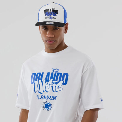 The model is wearing this NBA London Game 2026 Orlando Magic Oversized T-Shirt in white. 6