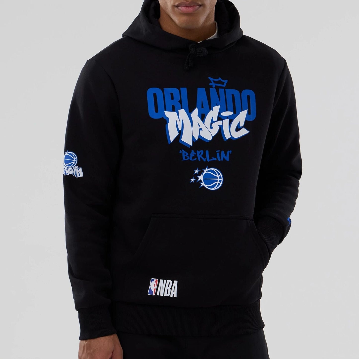 The model is wearing this NBA Berlin Game 2026 Orlando Magic Pullover Hoodie in black. 4