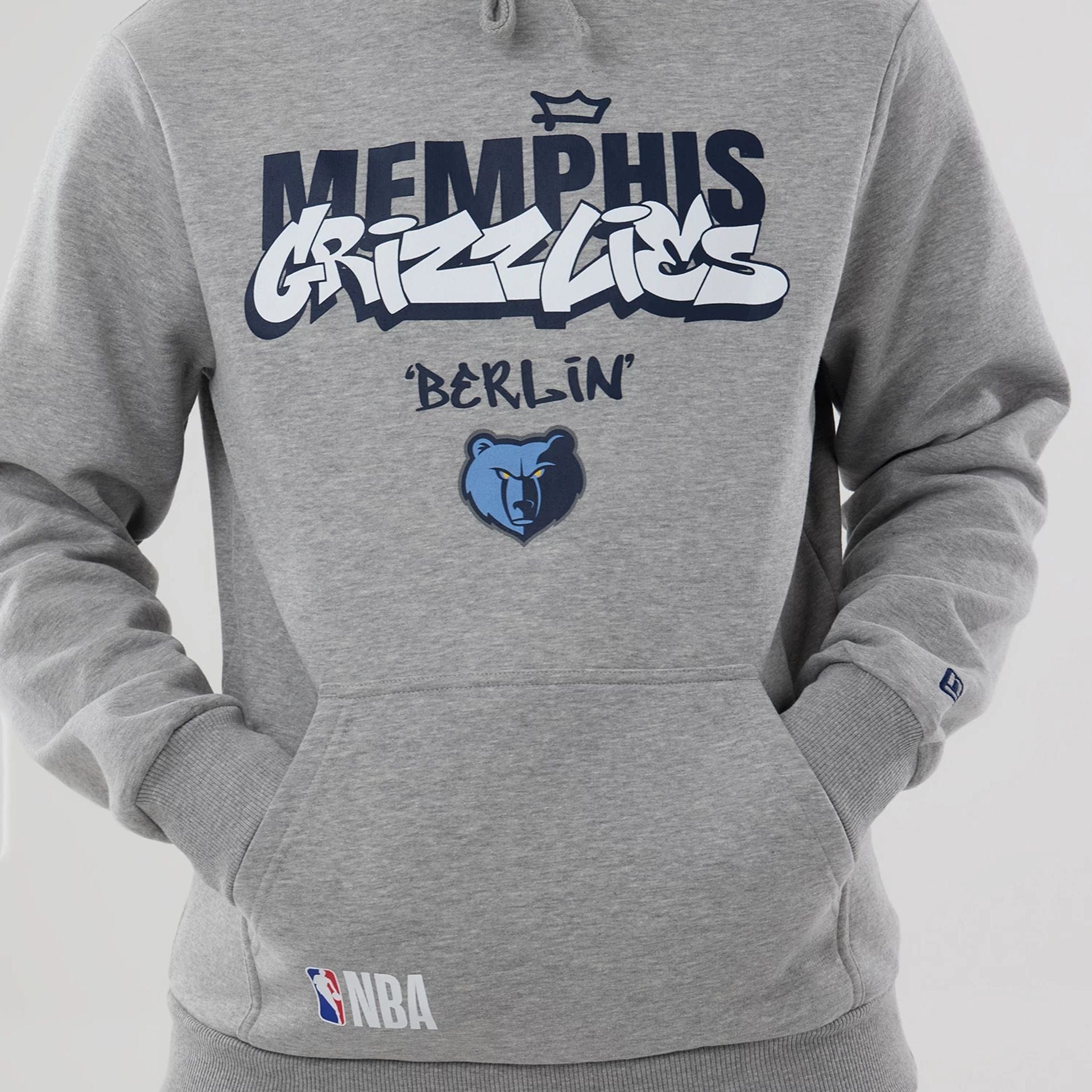 The model is wearing this NBA Berlin Game 2026 Memphis Grizzlies Pullover Hoodie in grey. 5