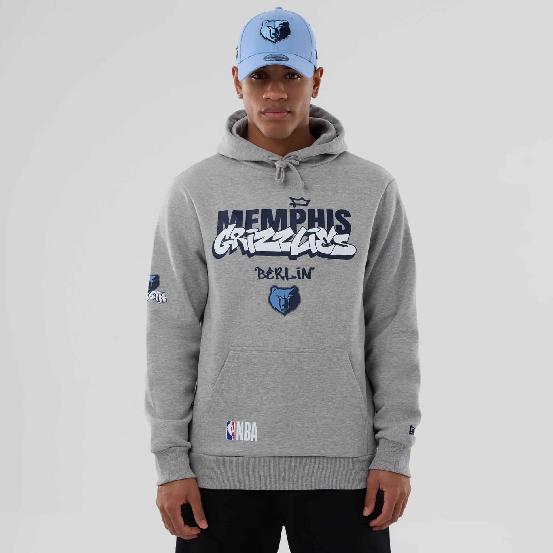 The model is wearing this NBA Berlin Game 2026 Memphis Grizzlies Pullover Hoodie in grey. 1
