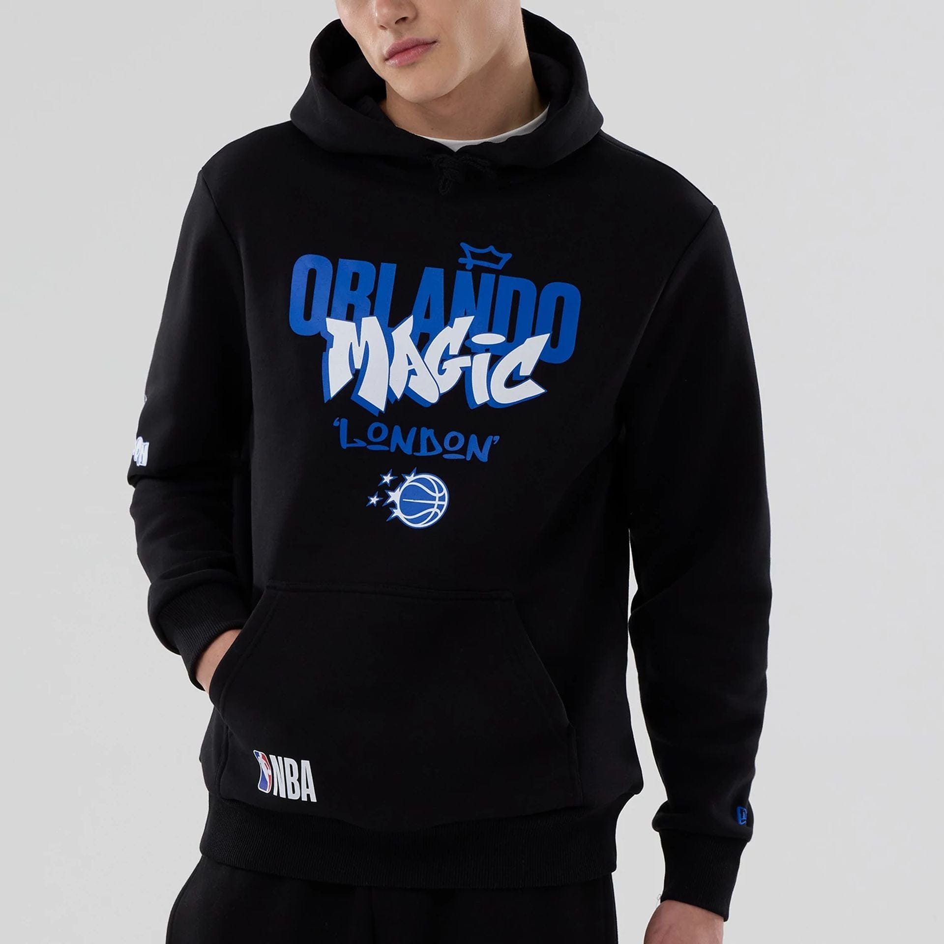 The model is wearing this NBA London Game 2026 Orlando Magic Pullover Hoodie in black. 3