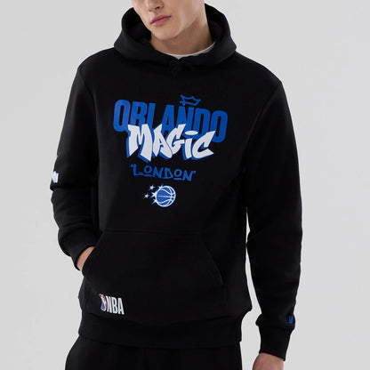 The model is wearing this NBA London Game 2026 Orlando Magic Pullover Hoodie in black. 3