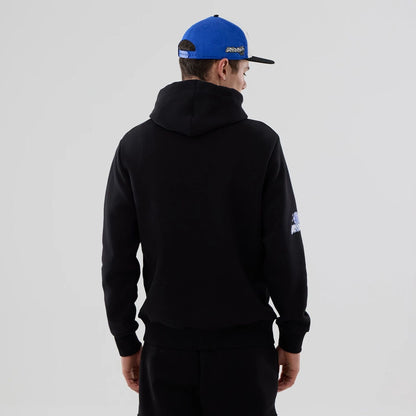 The model is wearing this NBA London Game 2026 Orlando Magic Pullover Hoodie in black. 2