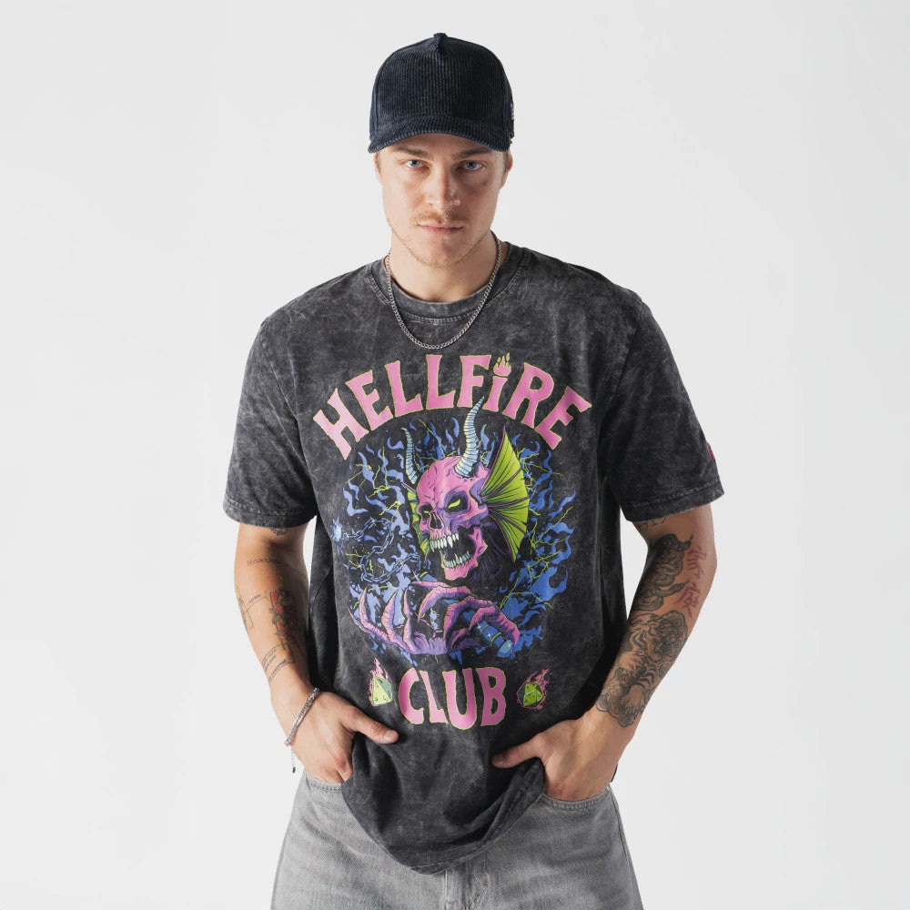 The model is wearing this Netflix Stranger Things Hell Fire Club T-Shirt in black. 1