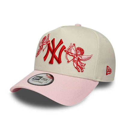 New York Yankees MLB Cherub Cream & Pink New Era 9FORTY A-Frame Adjustable Cap, front view showing raised red NY logo embroidery centred between two cherub graphics, a pastel pink curved visor and a 9FORTY size sticker on the visor.