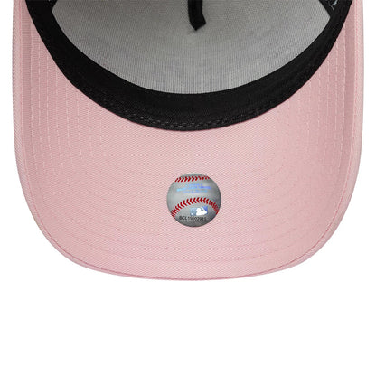 New York Yankees MLB Cherub Cream & Pink New Era 9FORTY A-Frame Adjustable Cap, inside view showing the pink undervisor with a baseball-themed sticker, black sweatband lining the crown, and grey fabric lining the interior panels.