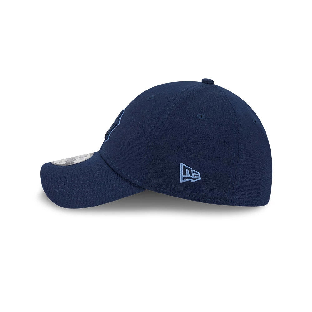 Yankees MLB Faded Oceanside Dark Blue New Era 39THIRTY Stretch Fit Cap, side view showing the light blue embroidered New Era flag logo on the left side, a curved visor with a 39THIRTY size sticker, and a structured dark blue crown.