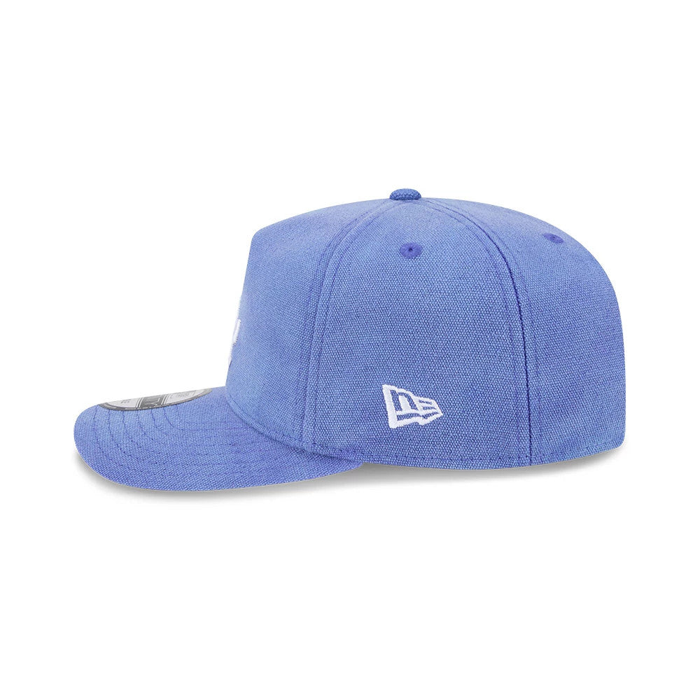 LA Dodgers MLB Duck Canvas Pastel Blue New Era 19TWENTY Adjustable Cap, side view showing the white embroidered New Era flag logo on the left side, structured crown, flat visor, and top button all in pastel blue.
