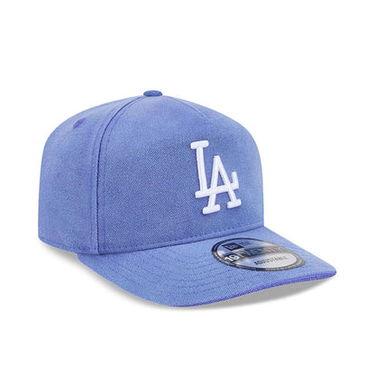 LA Dodgers MLB Duck Canvas Pastel Blue New Era 19TWENTY Adjustable Cap, three-quarter view showing the white LA logo in raised embroidery on the structured canvas crown, with a curved visor and the 19TWENTY size sticker on the visor.