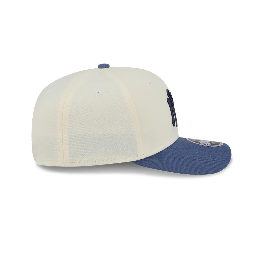 Pictured is this MLB Slate Stone New York Yankees 9SEVENTY Stretch Snap cap in cream & dark blue. 6