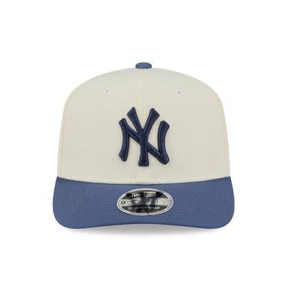 Pictured is this MLB Slate Stone New York Yankees 9SEVENTY Stretch Snap cap in cream & dark blue. 3