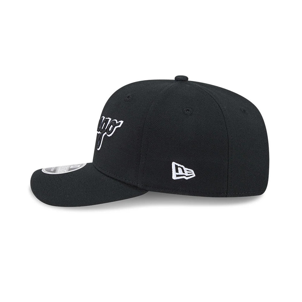 Chicago White Sox MLB Black New Era 9SEVENTY Stretch Snap Adjustable Cap, side view showing the white embroidered New Era flag logo on the left side, a curved black visor with a 9SEVENTY size sticker, and a structured black crown.