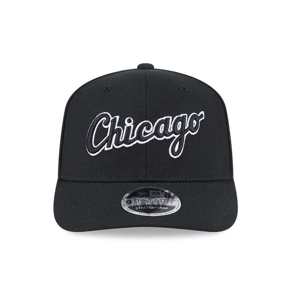 Chicago White Sox MLB Black New Era 9SEVENTY Stretch Snap Adjustable Cap, front view showing the white embroidered Chicago script logo centred on the structured black crown with a curved visor and a 9SEVENTY size sticker on the visor.