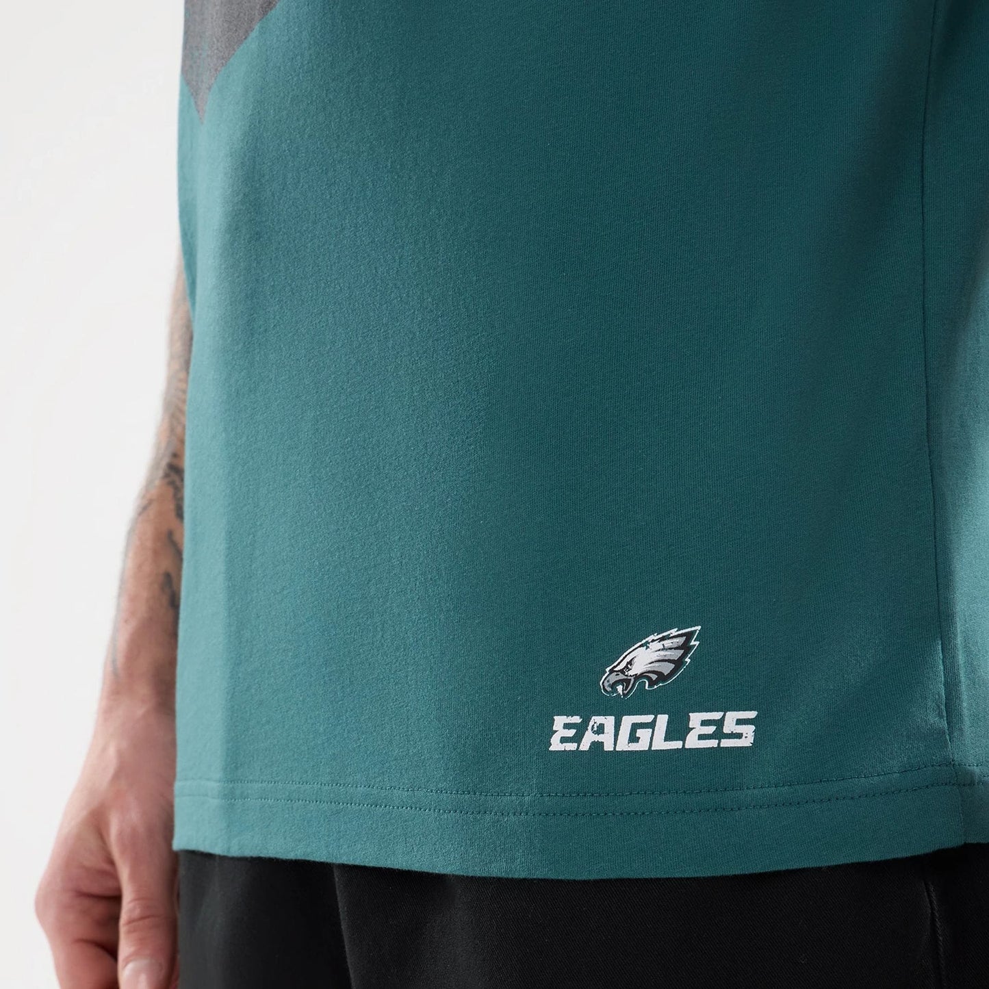 The model is wearing this NFL Training 2026 Philadelphia Eagles T-Shirt in dark green. 5