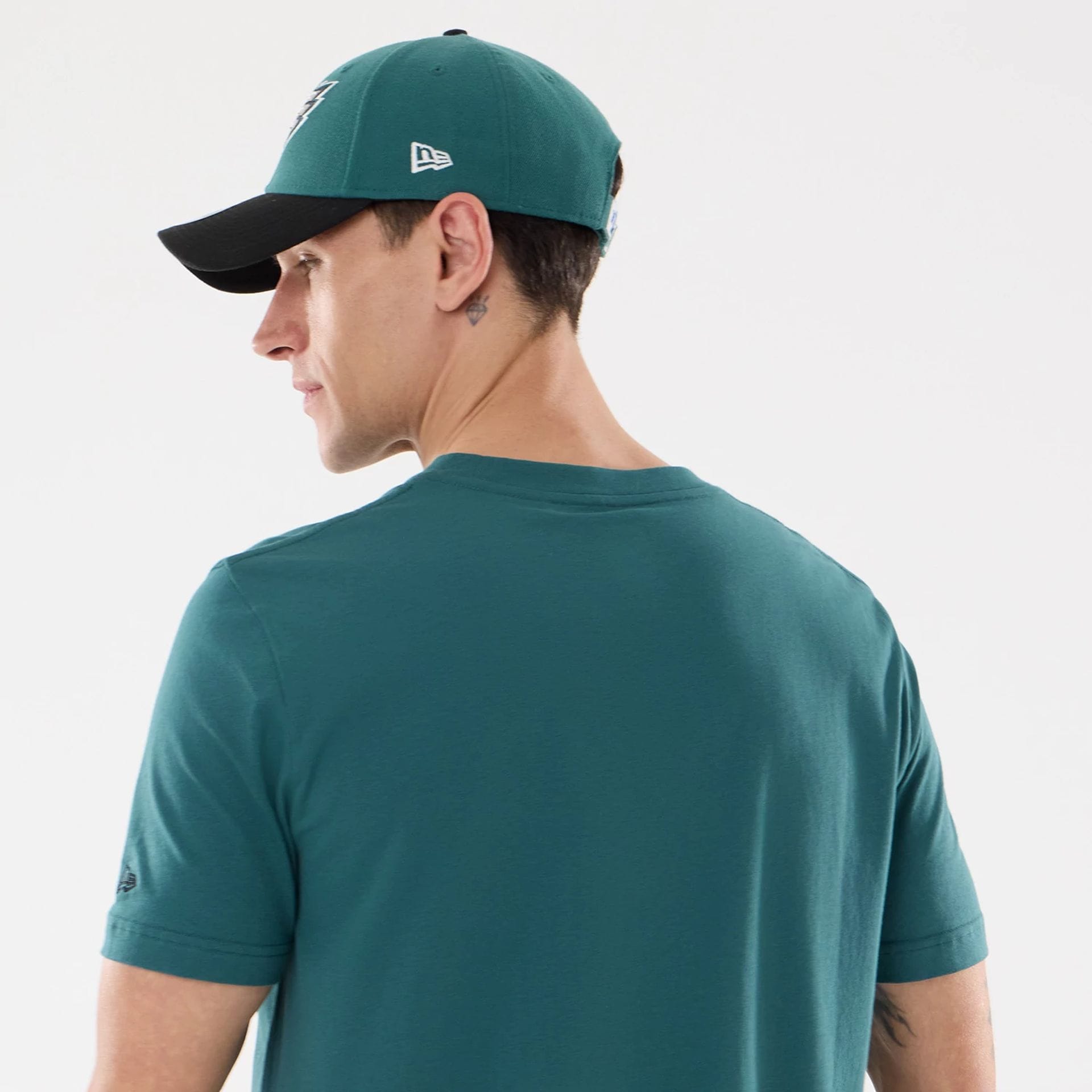 The model is wearing this NFL Training 2026 Philadelphia Eagles T-Shirt in dark green. 6