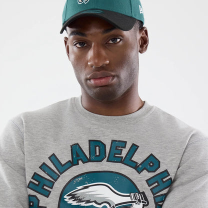 The model is wearing this NFL Training 2026 Philadelphia Eagles Crew Neck Sweater in grey. 4