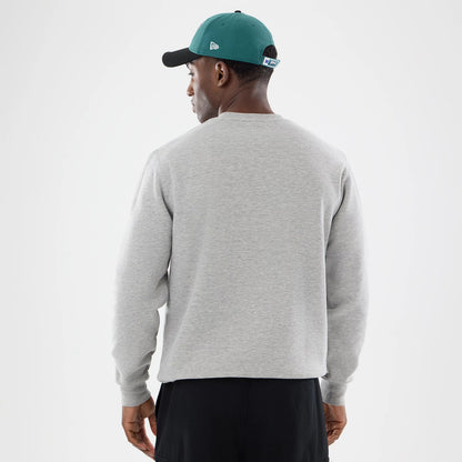 The model is wearing this NFL Training 2026 Philadelphia Eagles Crew Neck Sweater in grey. 2