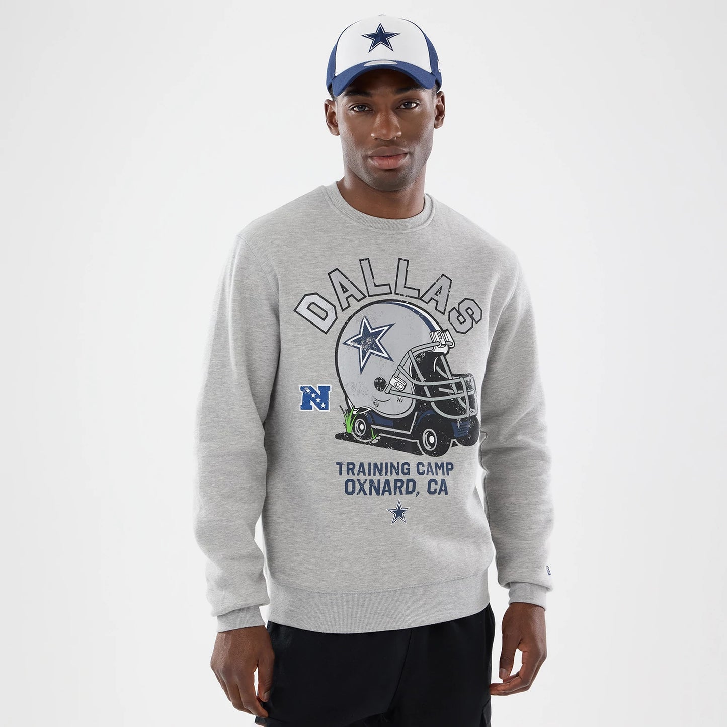 The model is wearing this NFL Training 2026 Dallas Cowboys Crew Neck Sweater in grey. 1