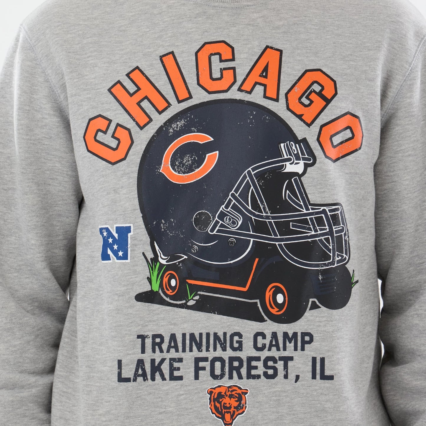 The model is wearing this NFL Training 2026 Chicago Bears Crew Neck Sweater in grey. 4