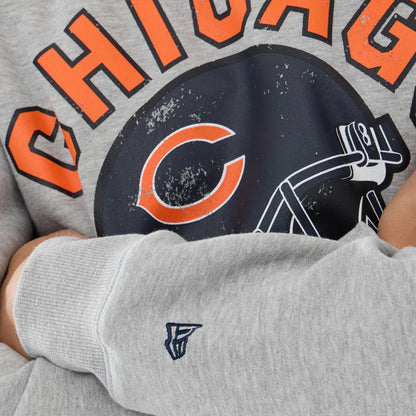 The model is wearing this NFL Training 2026 Chicago Bears Crew Neck Sweater in grey. 5