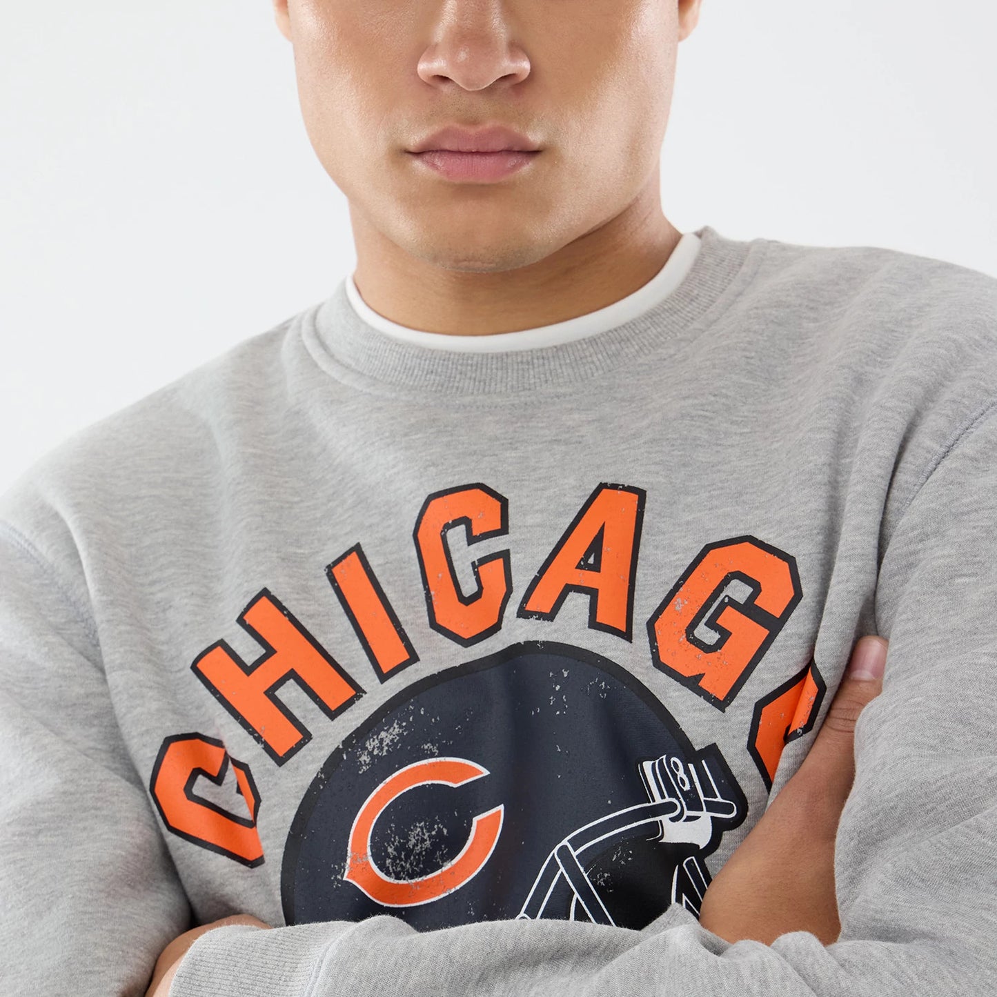 The model is wearing this NFL Training 2026 Chicago Bears Crew Neck Sweater in grey. 6