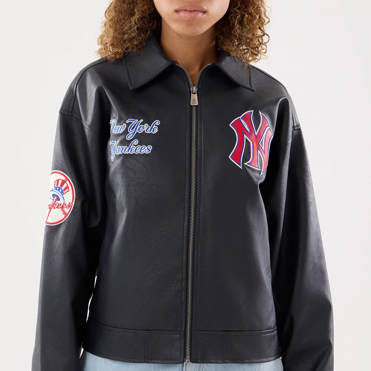 The model is wearing this Womens MLB New York Yankees Collared Jacket in black. 3