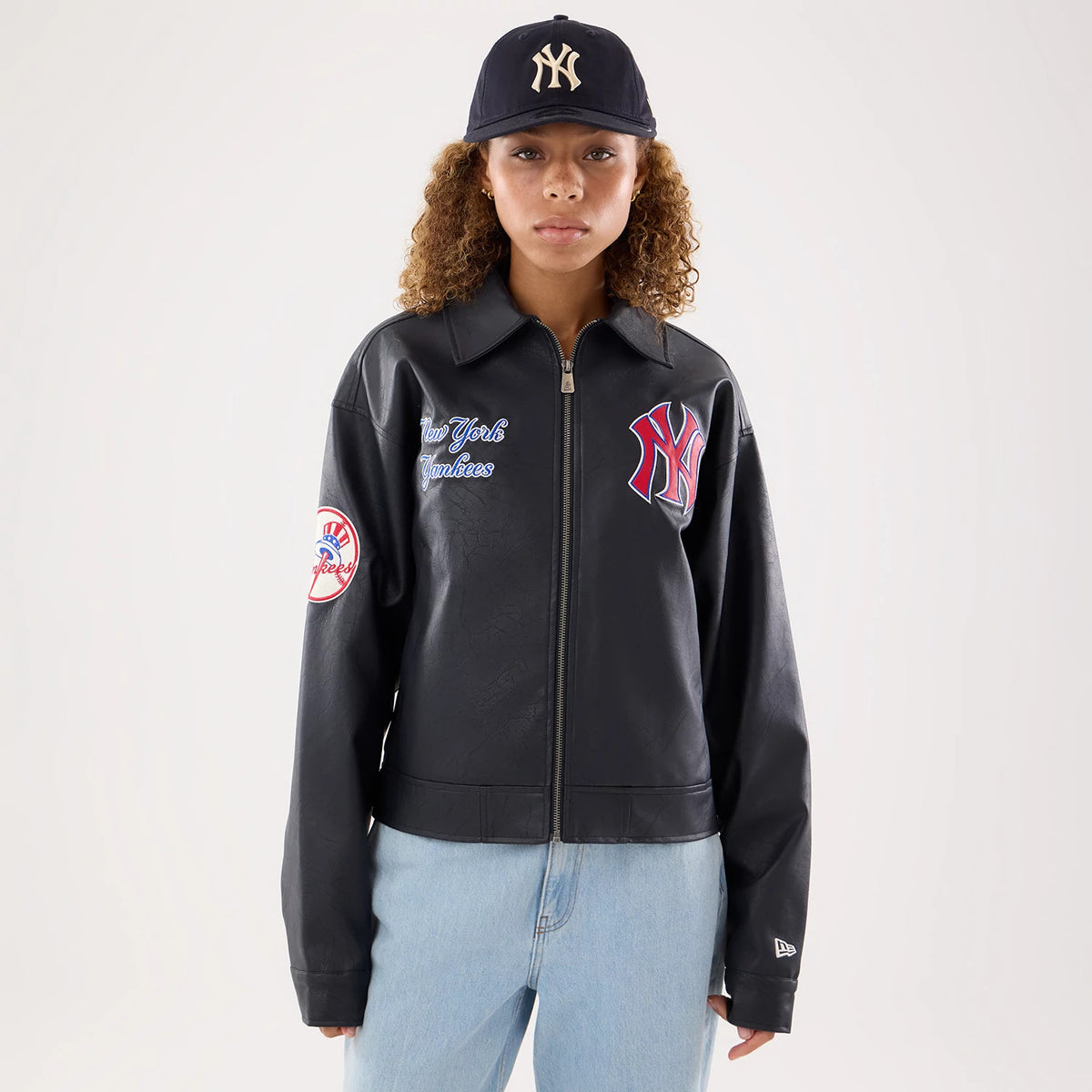 The model is wearing this Womens MLB New York Yankees Collared Jacket in navy. 1