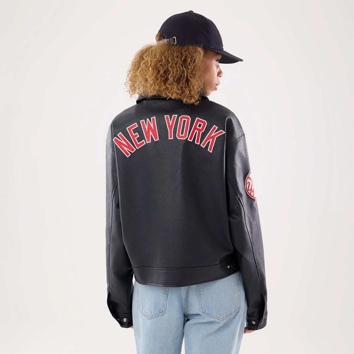 The model is wearing this Womens MLB New York Yankees Collared Jacket in navy. 2