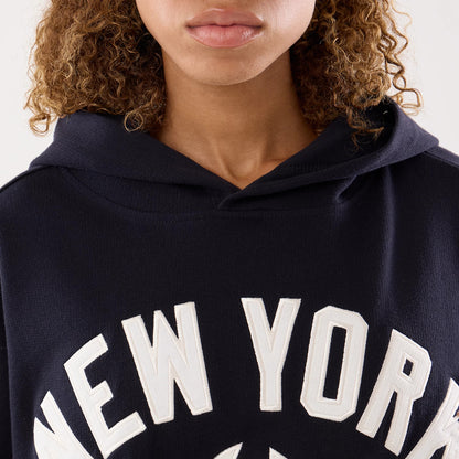 The model is wearing this Womens MLB New York Yankees Oversized Pullover Hoodie in navy. 5
