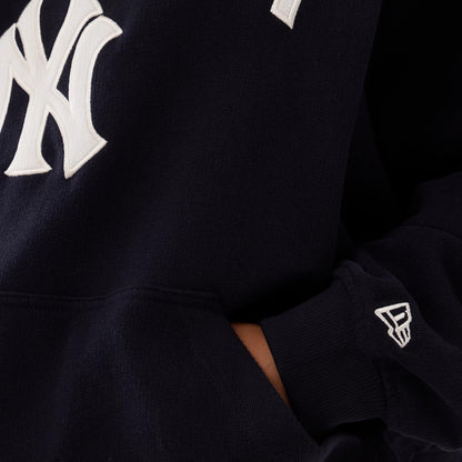 The model is wearing this Womens MLB New York Yankees Oversized Pullover Hoodie in navy. 6