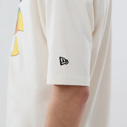 The model is wearing this MLB Food Graphic LA Dodgers Oversized T-Shirt in open white. 5