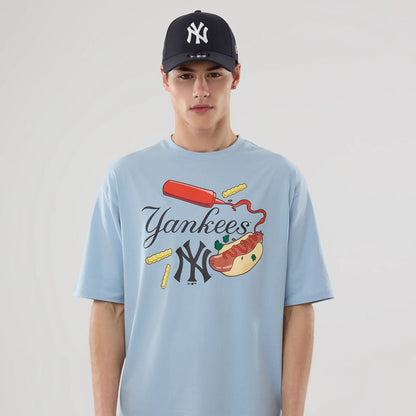 The model is wearing this MLB Food Graphic New York Yankees Oversized T-Shirt in pastel blue. 4