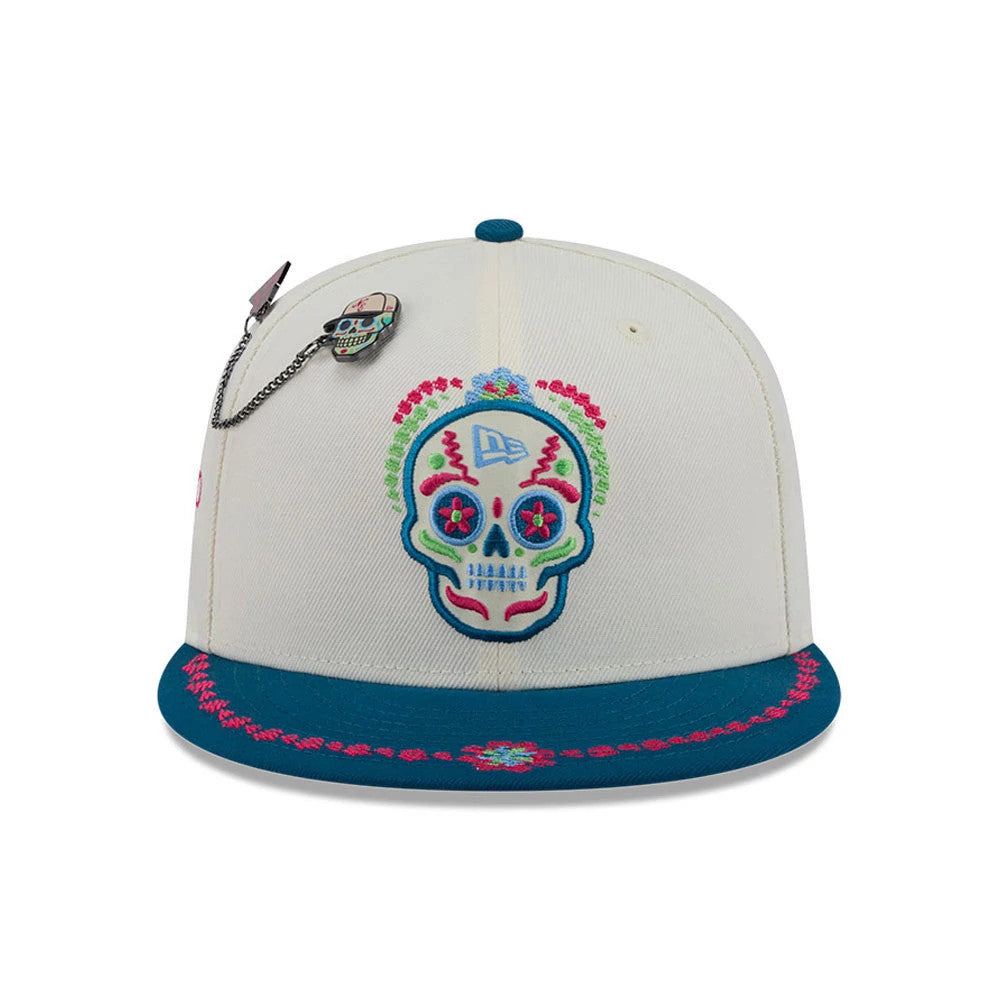 Pictured is this New Era Day Of The Dead 59FIFTY Fitted cap in light beige & blue. 3