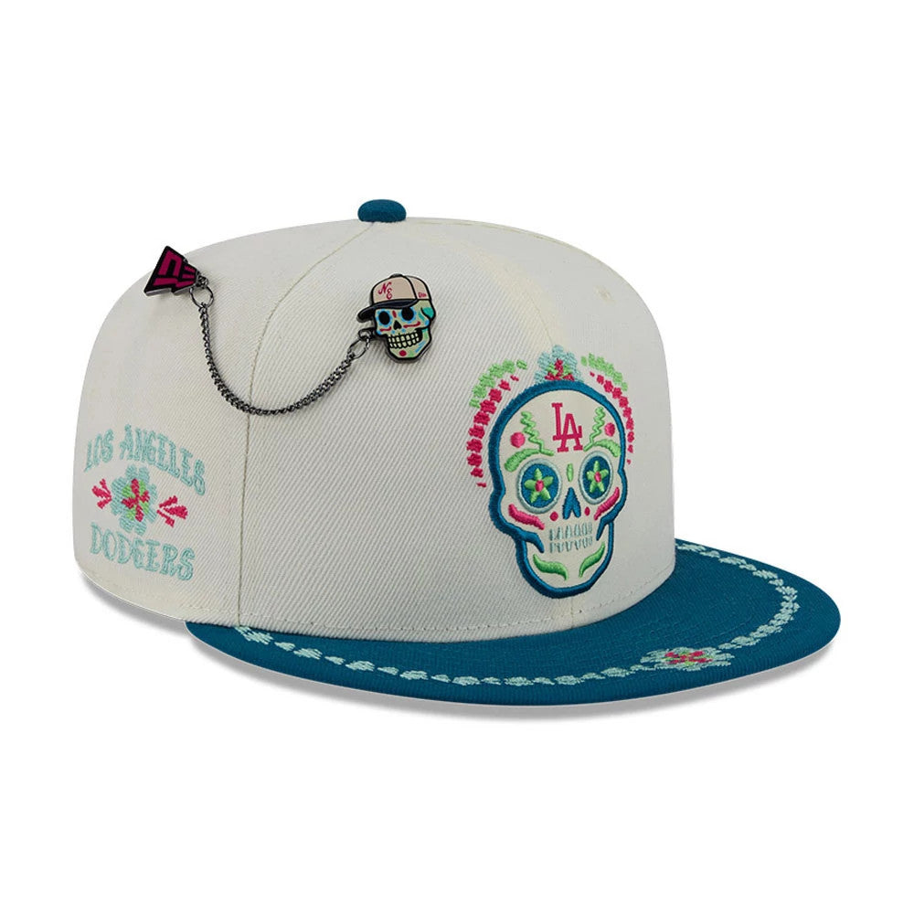 Pictured is this MLB Day Of The Dead LA Dodgers 59FIFTY Fitted cap in light beige & blue. 1