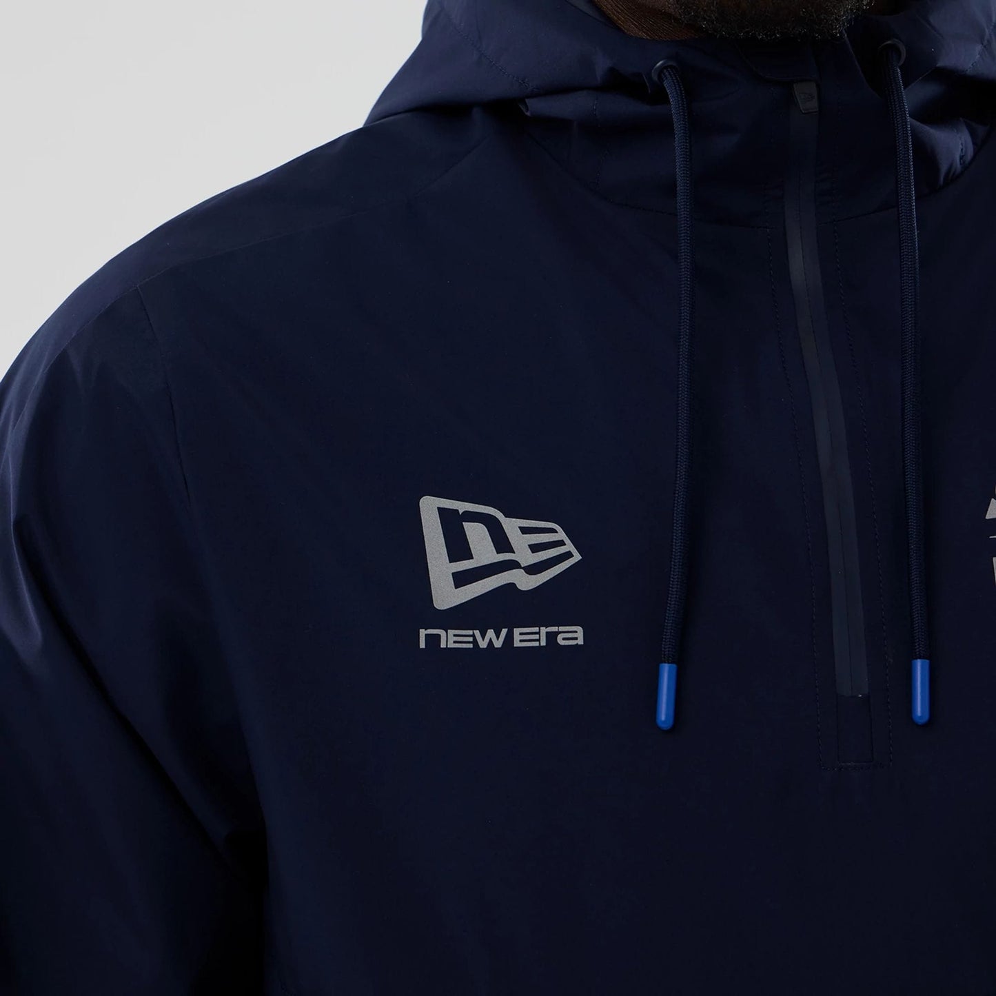 The model is wearing this Atlassian Williams F1 Team Windbreaker Jacket in navy. 5