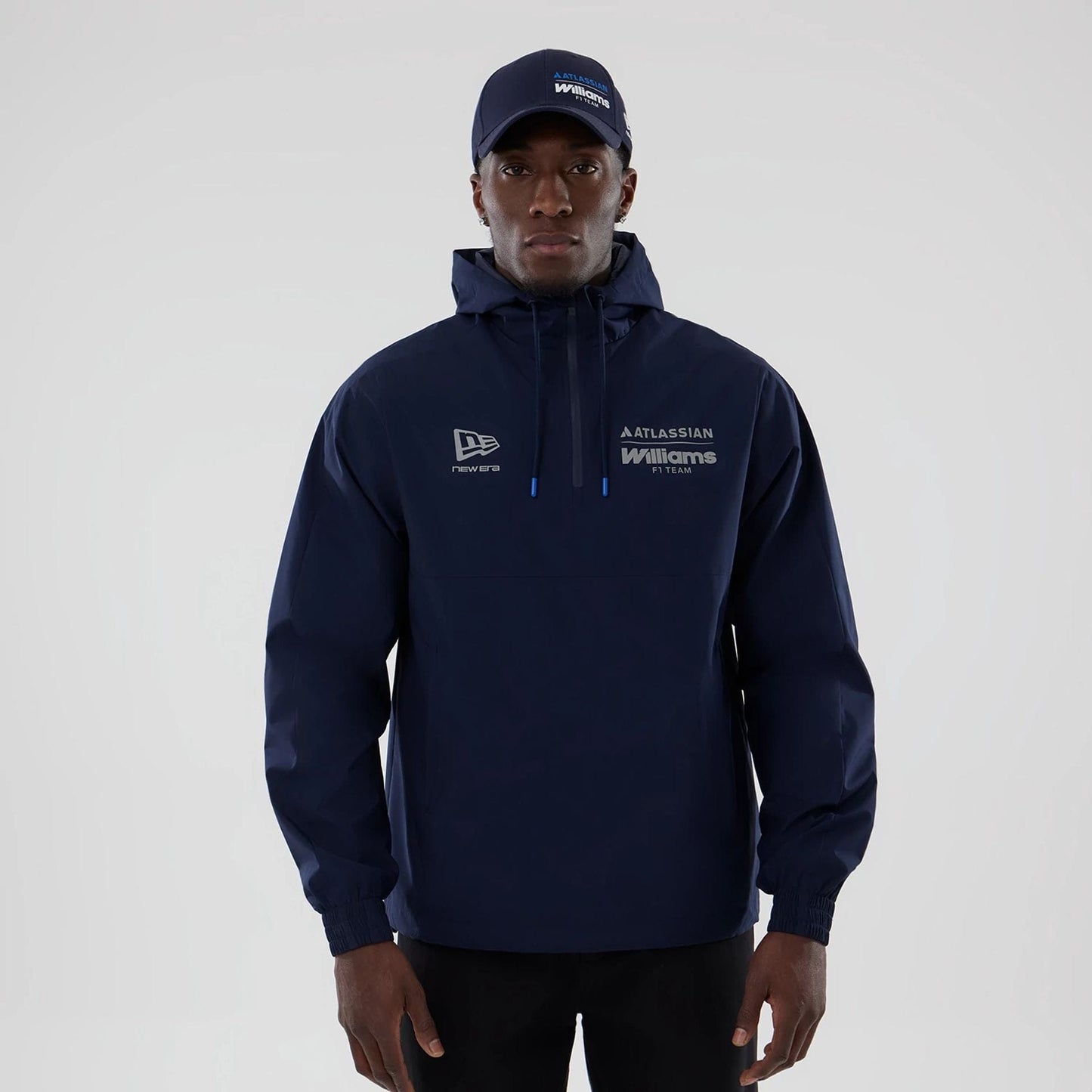 The model is wearing this Atlassian Williams F1 Team Windbreaker Jacket in navy. 1
