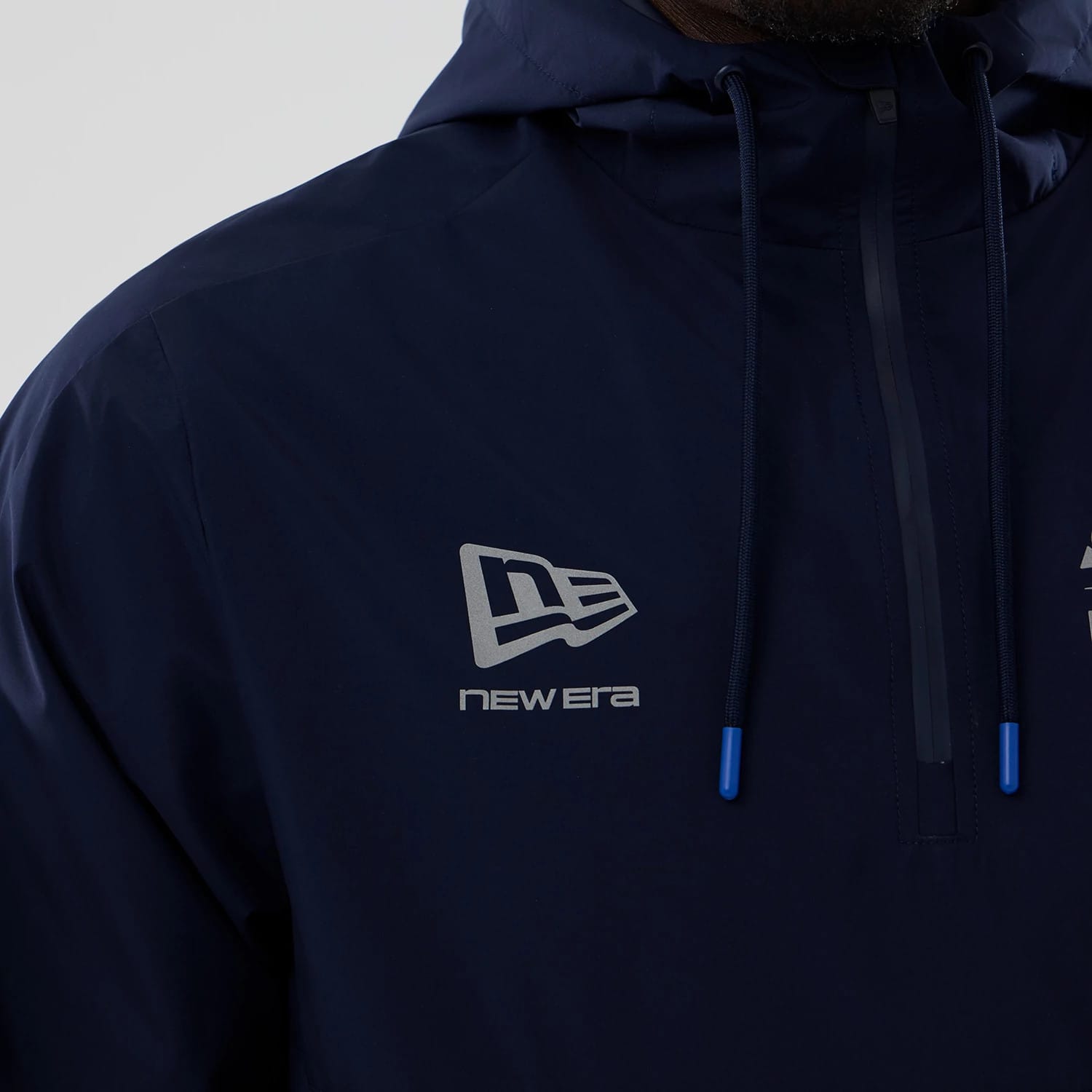 The model is wearing this Atlassian Williams F1 Team Windbreaker Jacket in navy. 5