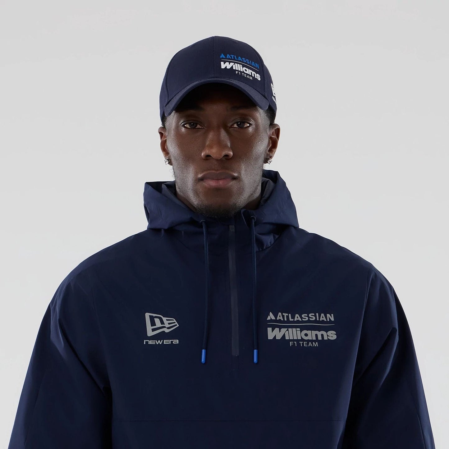 The model is wearing this Atlassian Williams F1 Team Windbreaker Jacket in navy. 3