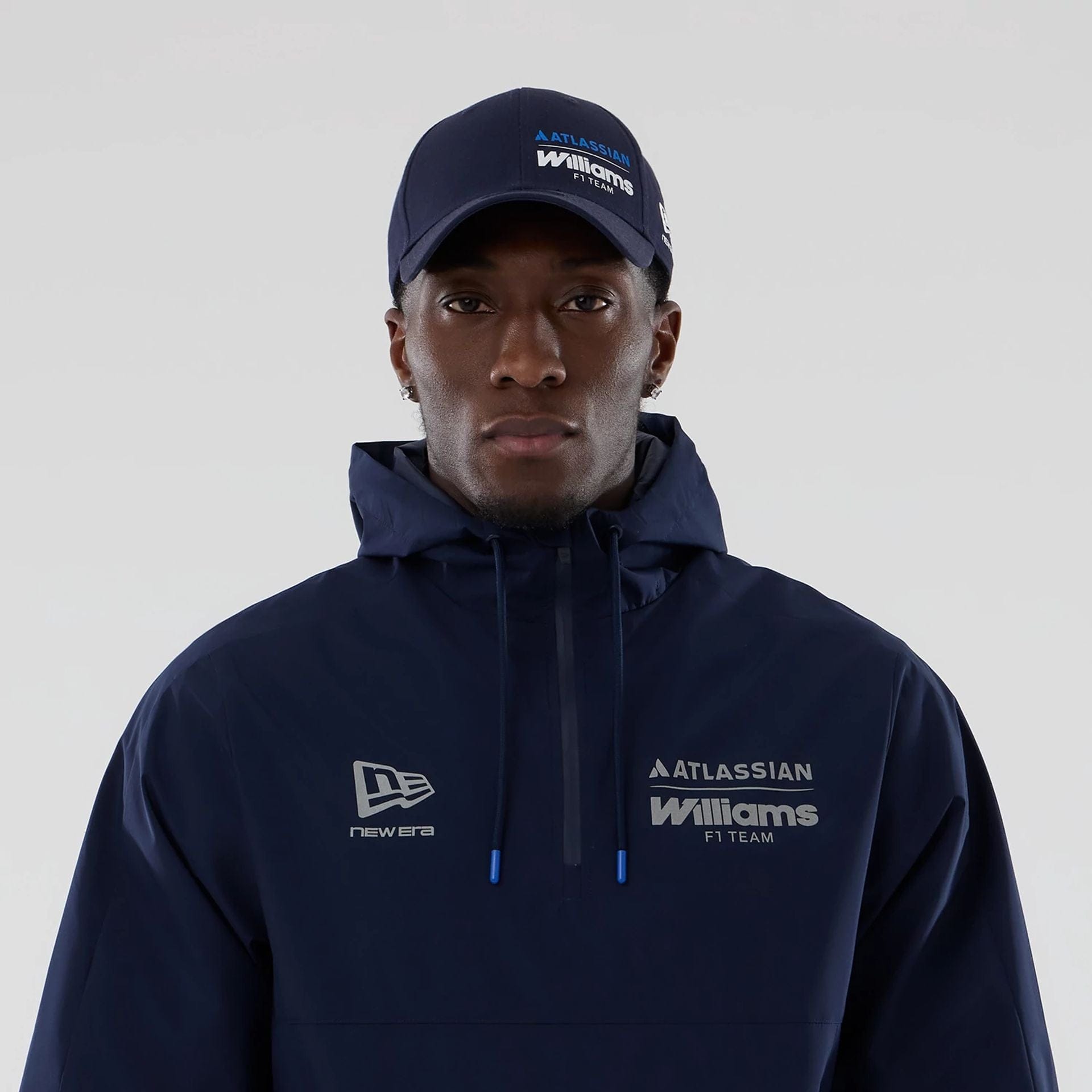 The model is wearing this Atlassian Williams F1 Team Windbreaker Jacket in navy. 3