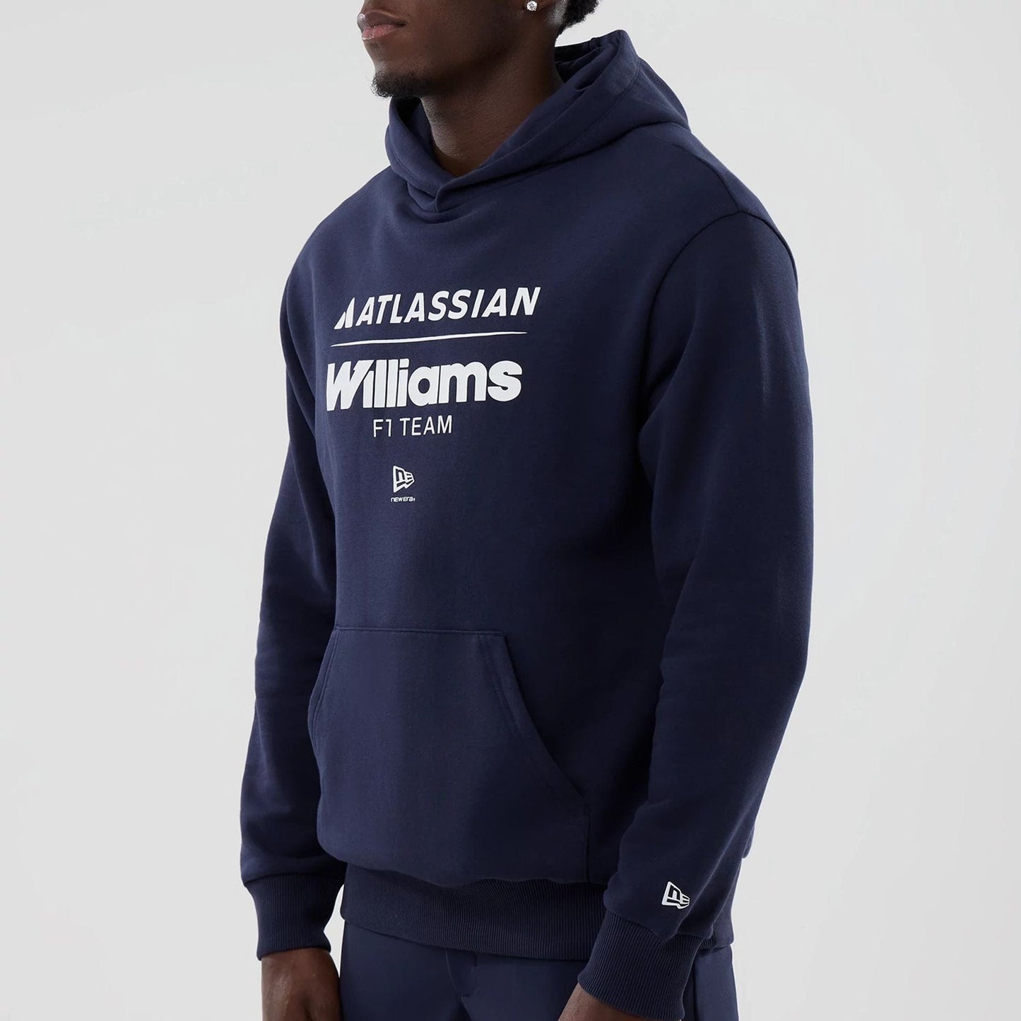 The model is wearing this Atlassian Williams F1 Team Oversized Pullover Hoodie in navy. 4